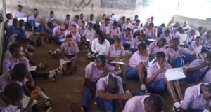 Photos of secondary school students writing their promotion exam on bare floor in Ogun state goes viral